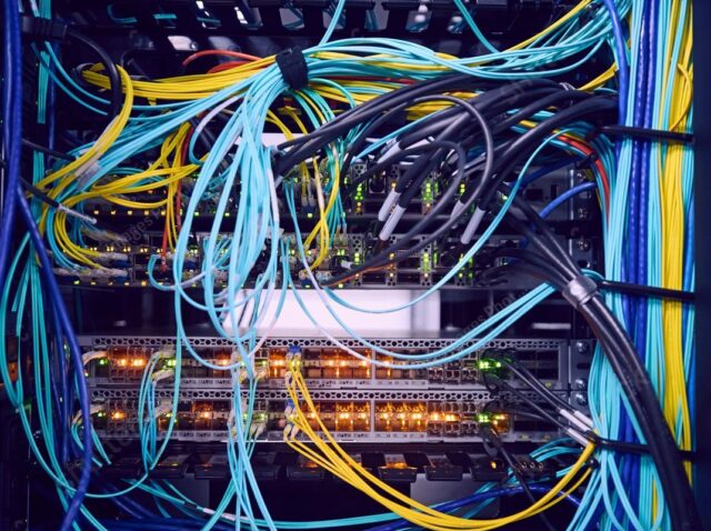 stock-photo-network-cables-in-server-room-2232739997